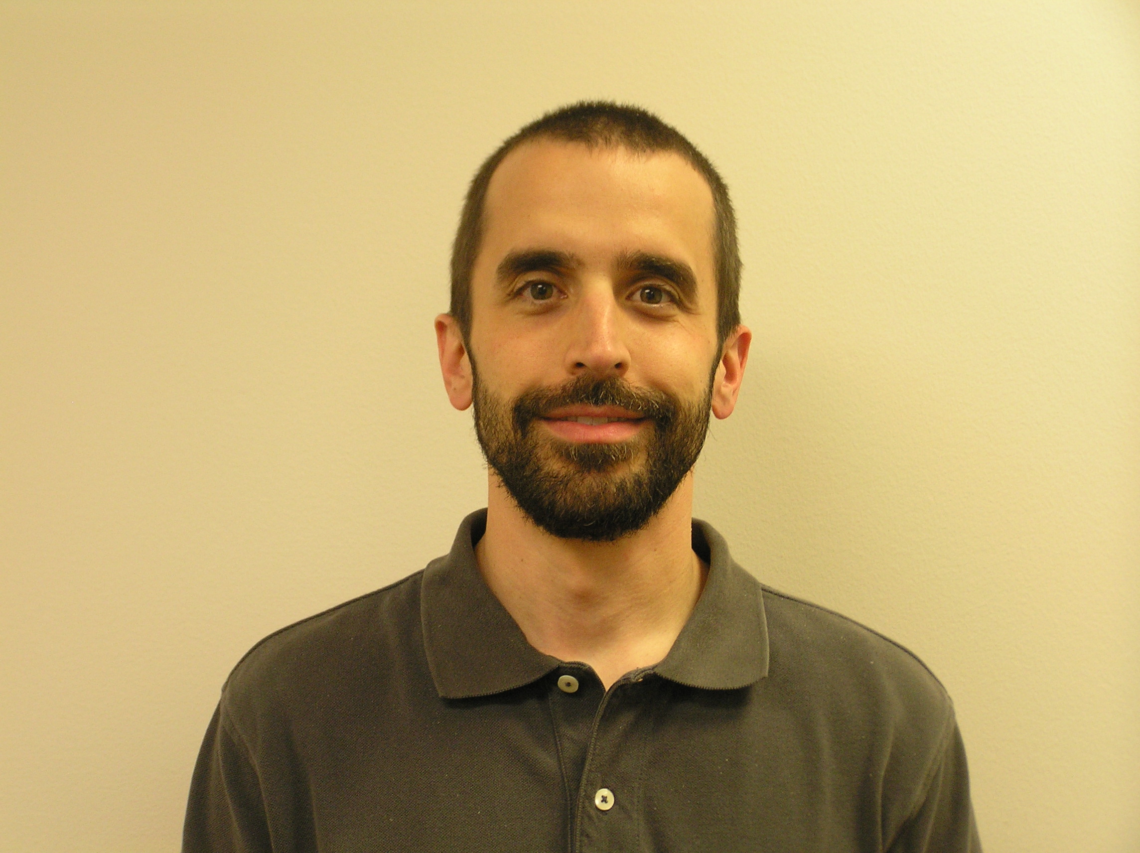 guy in green t-shirt with a beard